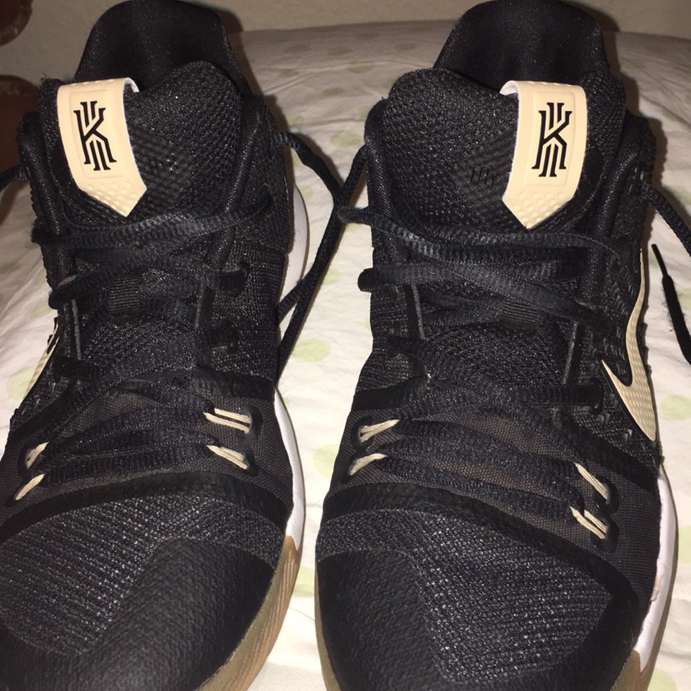 Black and gold Kyrie 3s